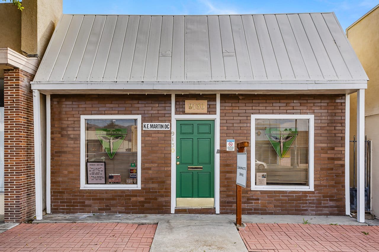 Brick storefront with a green door on Las Tunas Drive, Temple City