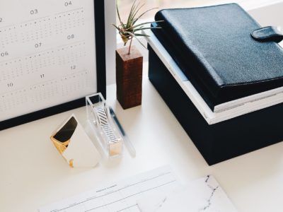 Desk with calendar on computer